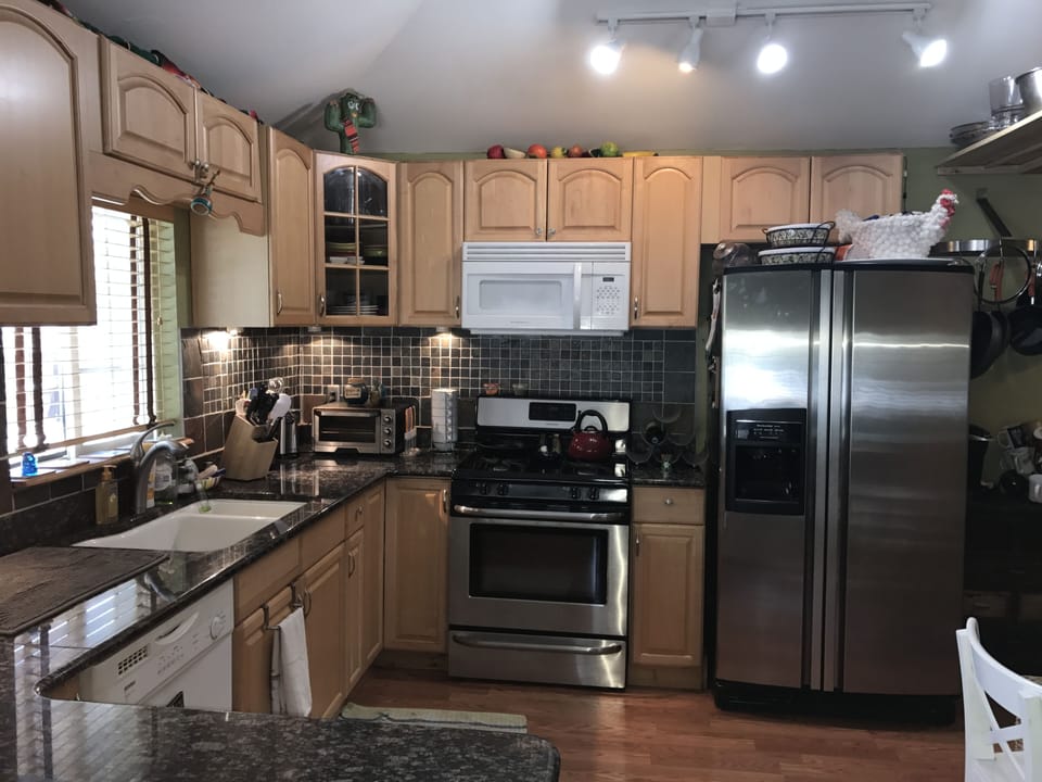 Kitchen with Gas Stove and Stainless Steel Refrigerator