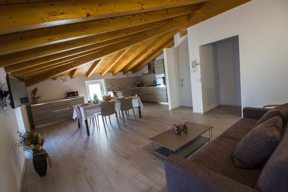 The full equipped kitchen + living-room of the new penthouse