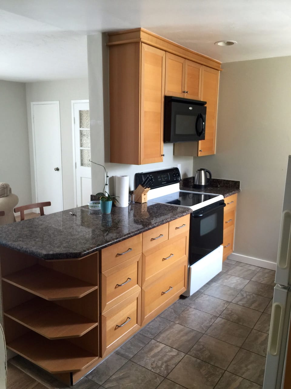 Granite countertops, new cabinets with lots of drawers for storage.