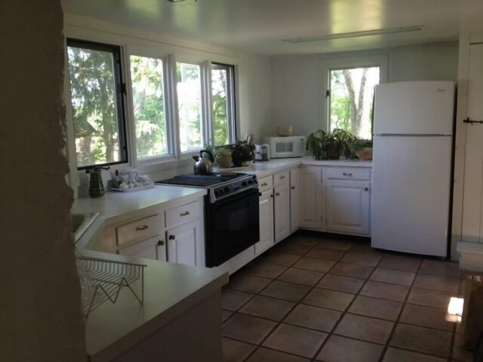 Kitchen with excellent view of gardens and horse farm 