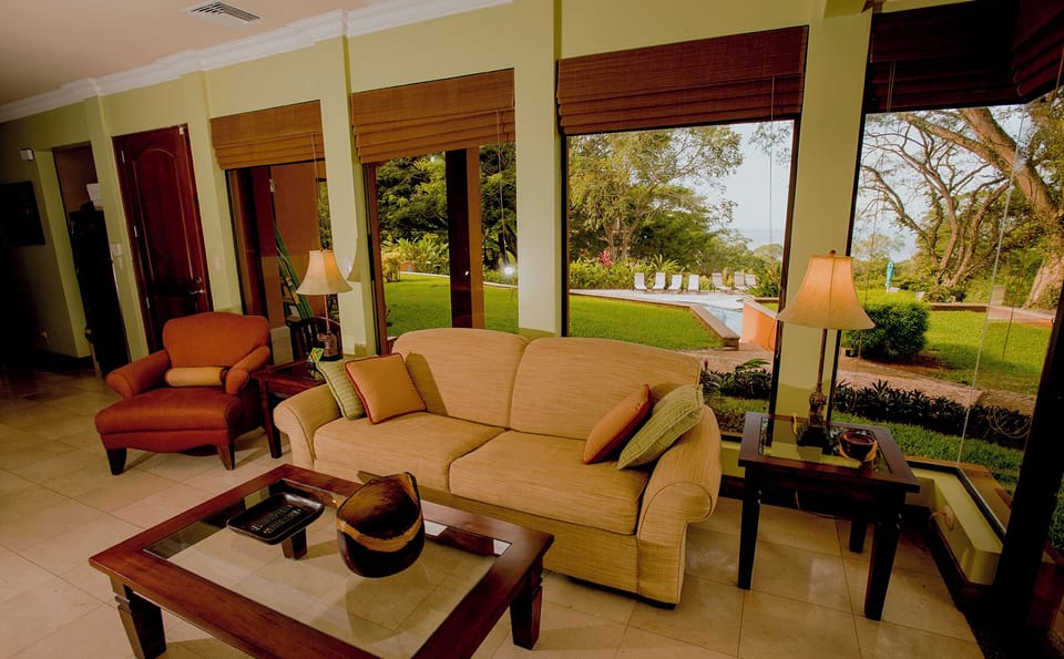 Living room with the Las Lomas private pool steps away from front door.