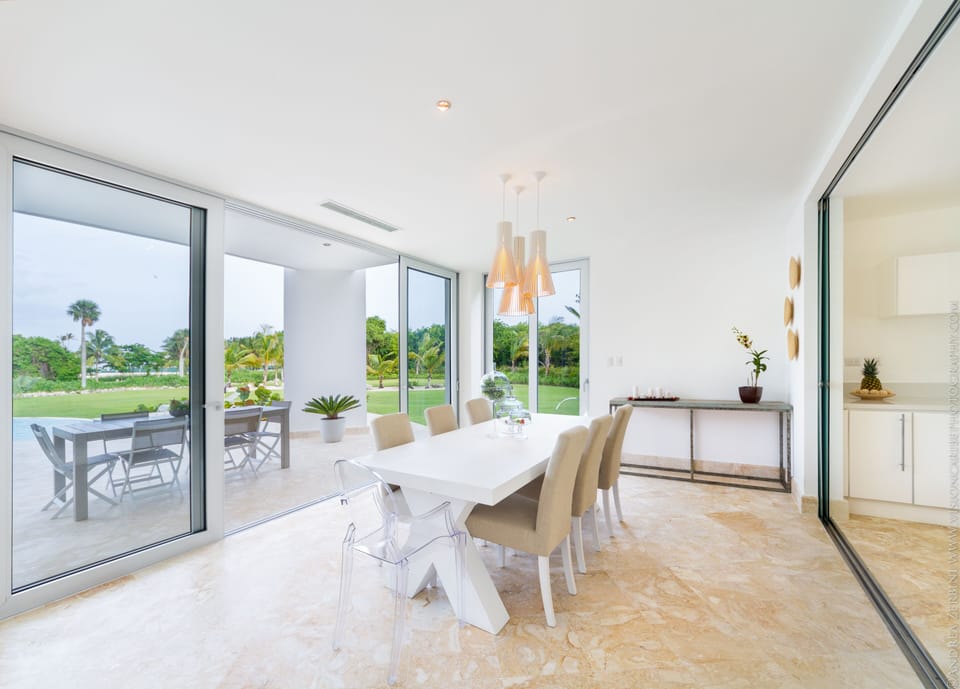 Dining area with views to the outdoor terrace. 