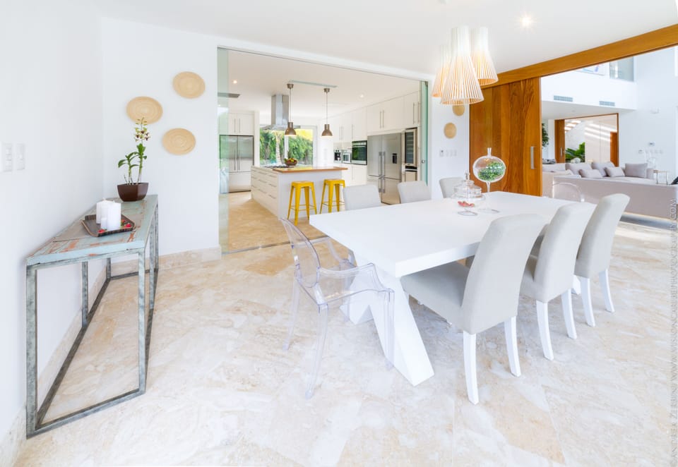 Dining area open to the kitchen. Option to close off kitchen with a mirror door
