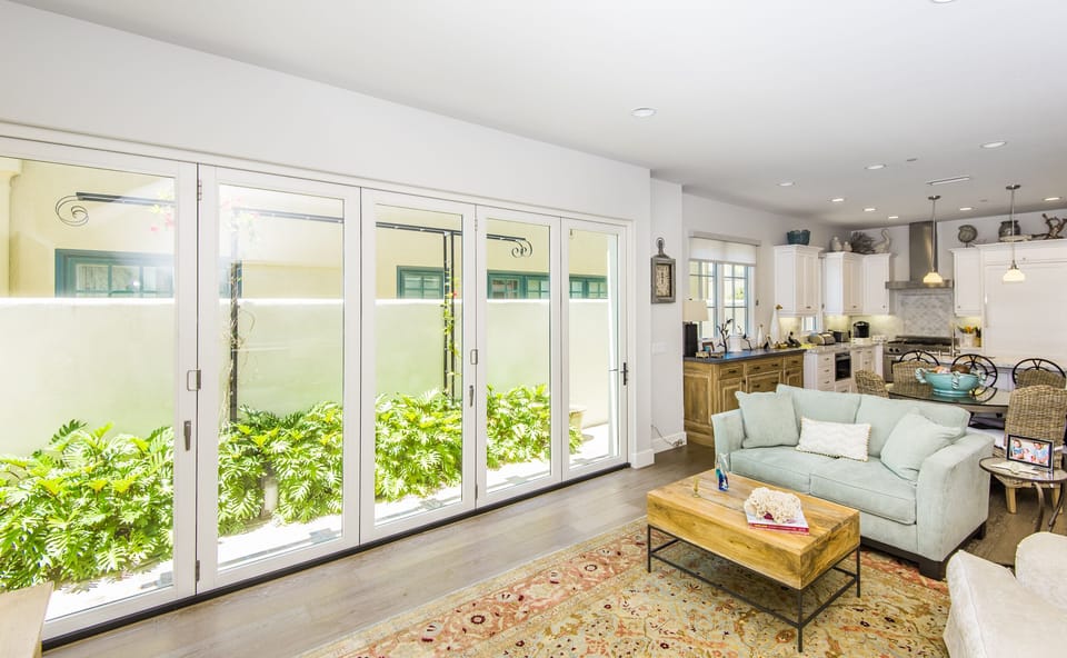 Open concept Great Room with La Cantina doors opening onto a private patio. 
