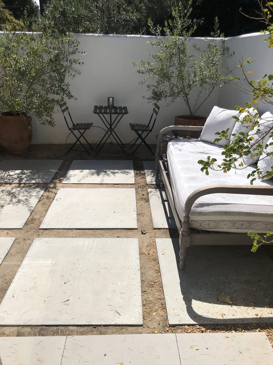 Private patio with daybed off primary bedroom, great for relaxing