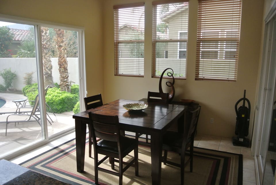 Kitchen eating area with walk through to pool and BBQ area