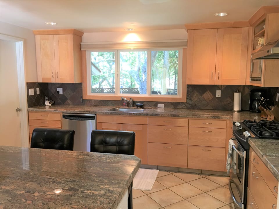 Granite breakfast bar seats 4.  Watch the deer go by out the kitchen window.