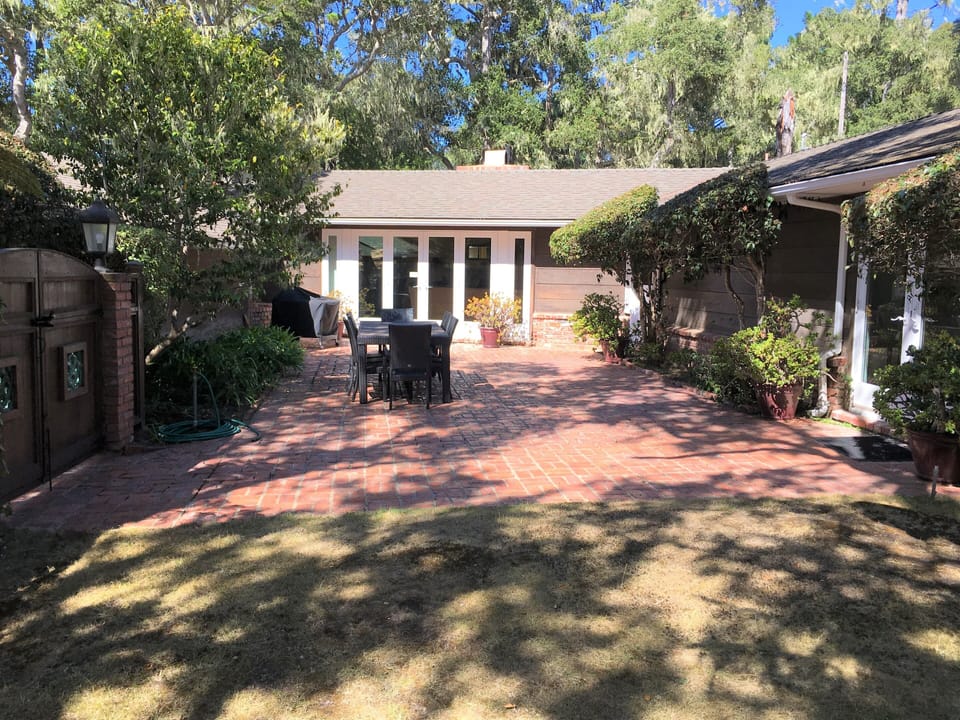 Front courtyard with french doors and dutch doors from living areas.