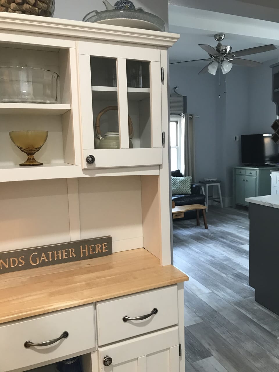 This white cabinet can be relocated if accessibility in the unit is needed.  