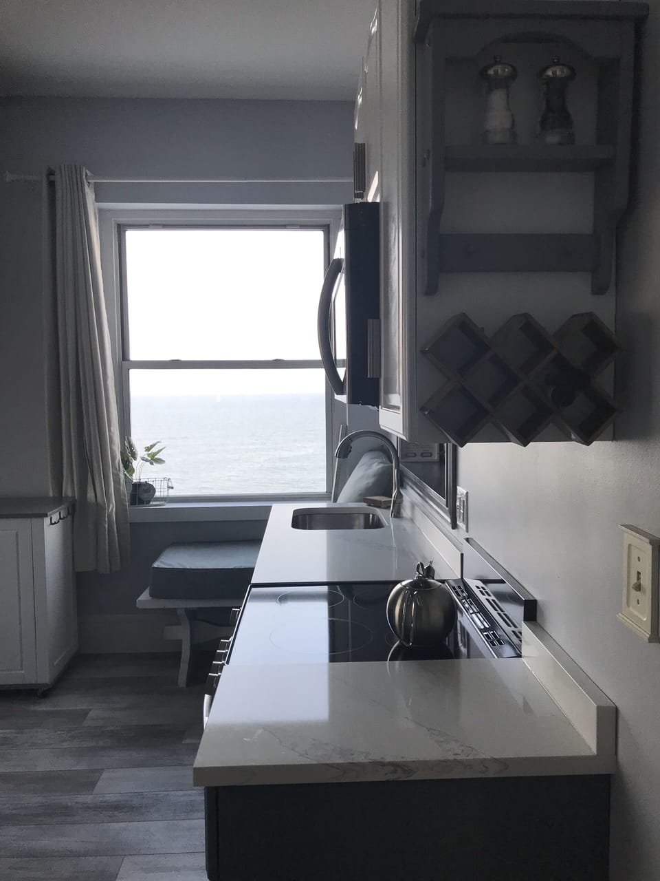 View walking out of the master bedroom with blue ocean right in front of you.