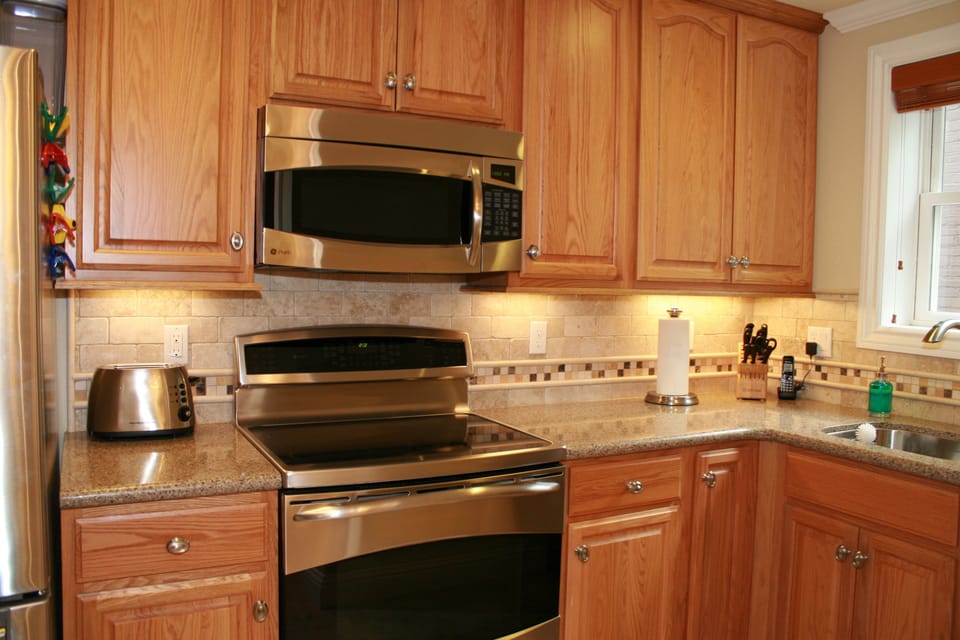 GE Profile Induction cooktop, convection oven, warming drawer, microwave