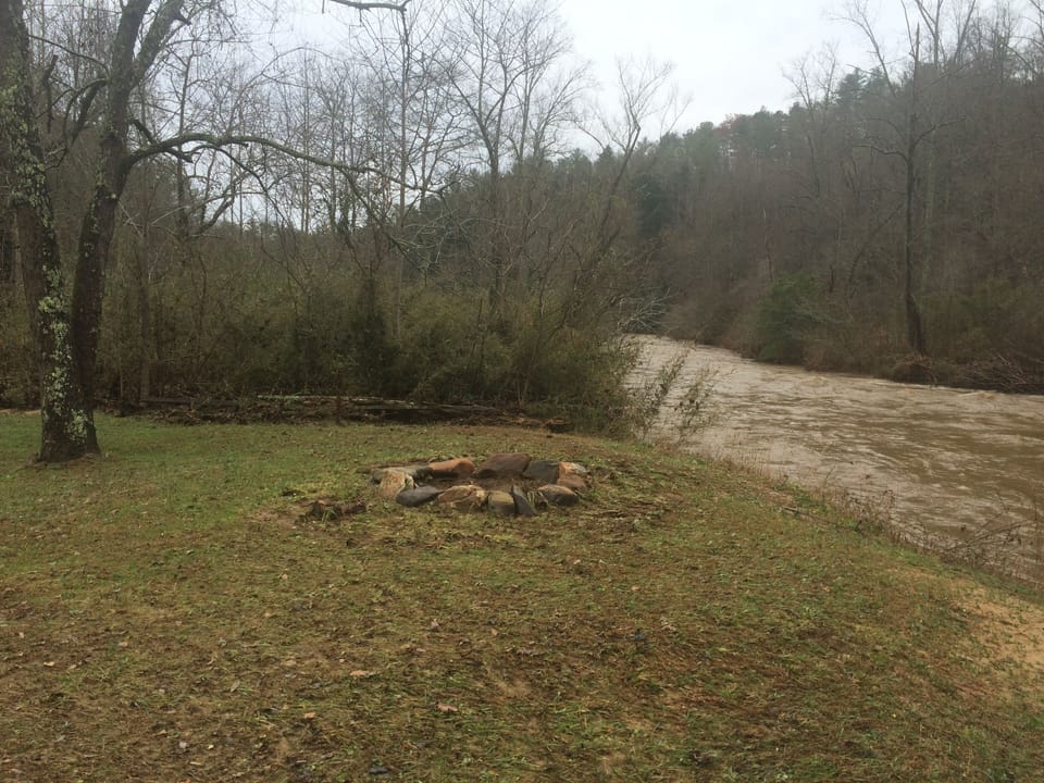 Sit around the fire pit while listening to the river...