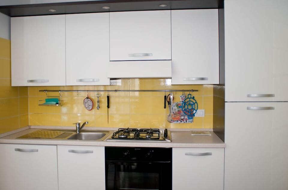 Kitchen with appliances pots and dishes