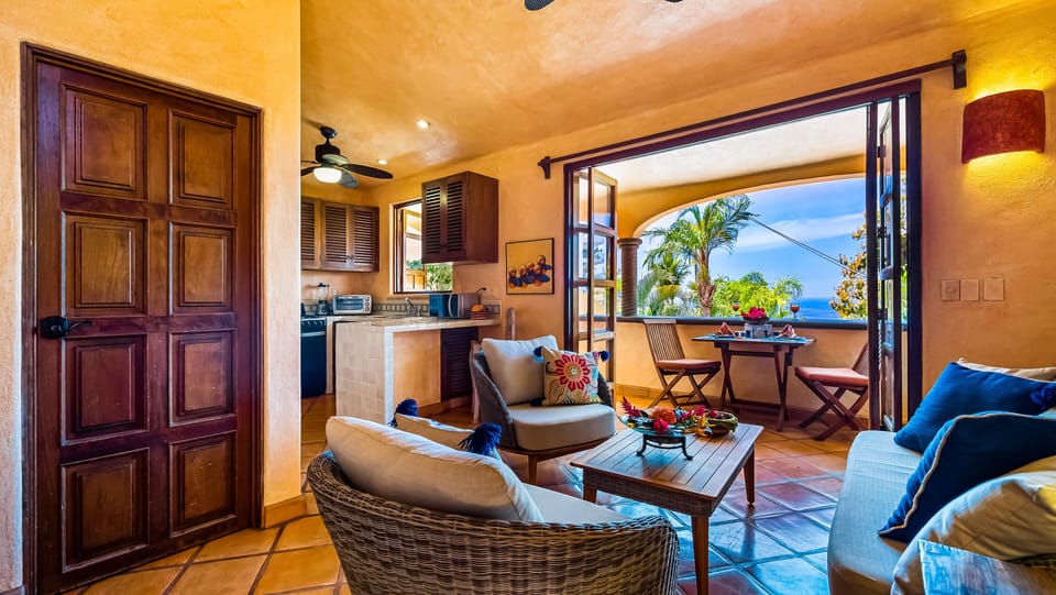 Open concept living room to the kitchen and balcony.