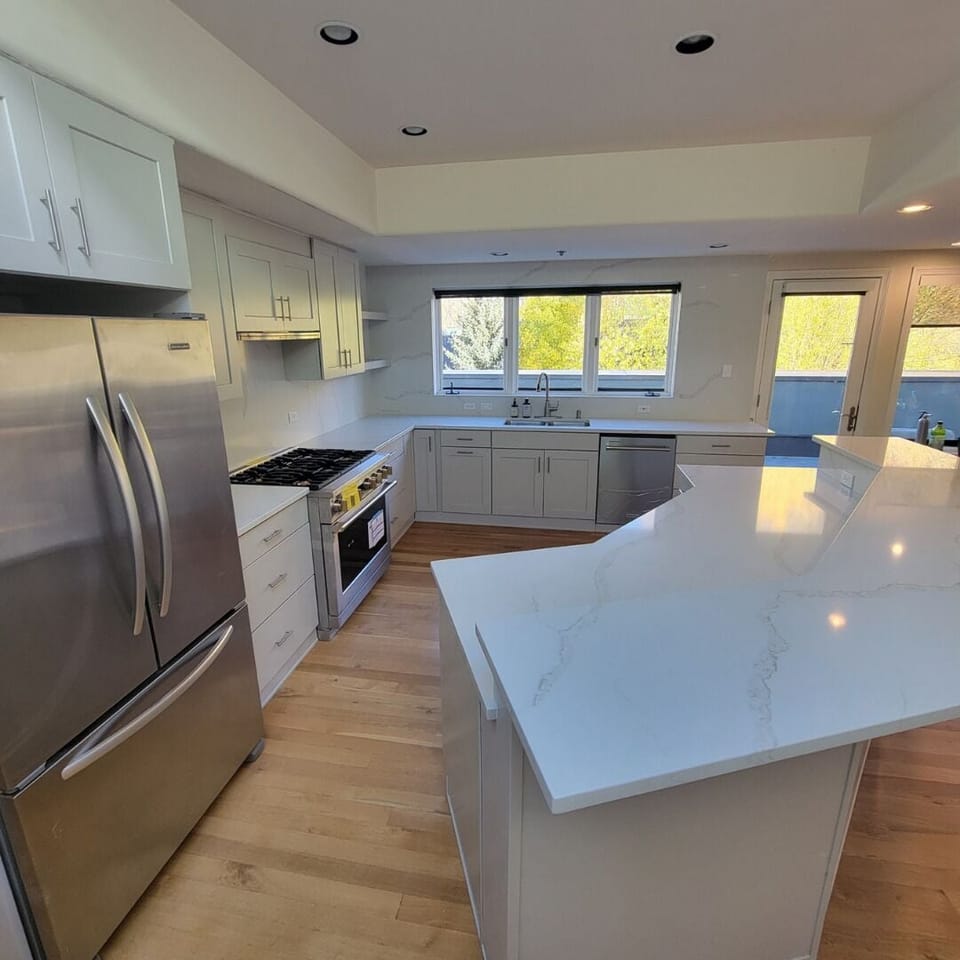 Kitchen flooded with natural light during the day.