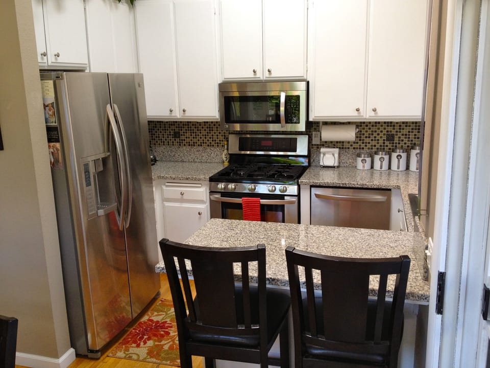 Seating for guests to keep you company as you cook.