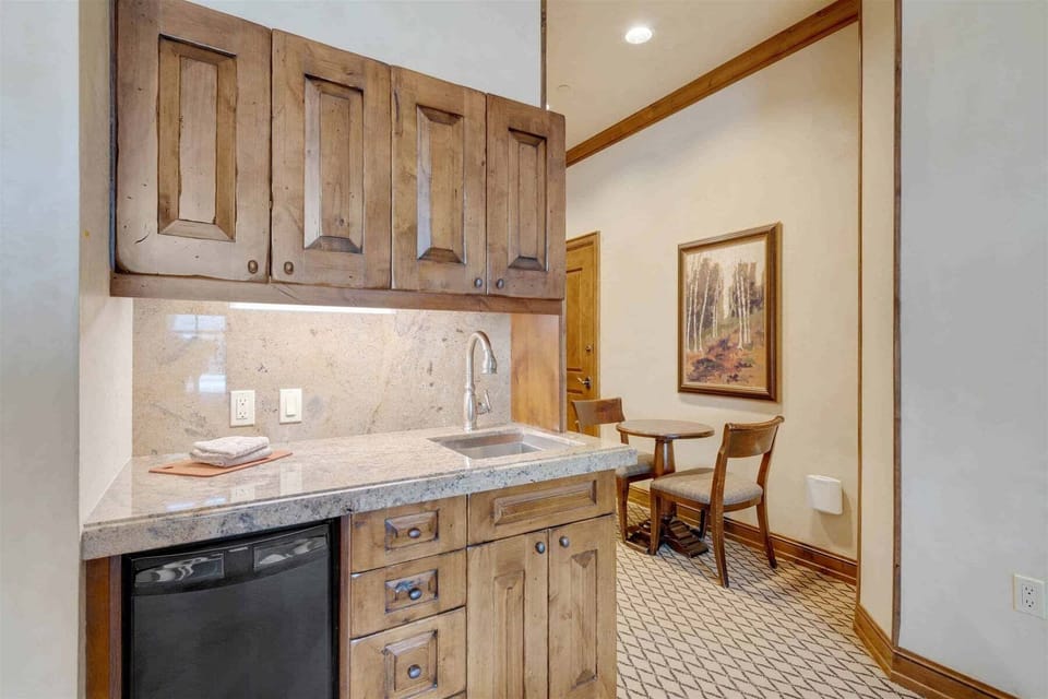 Primary bedroom features gas fireplace and kitchenette