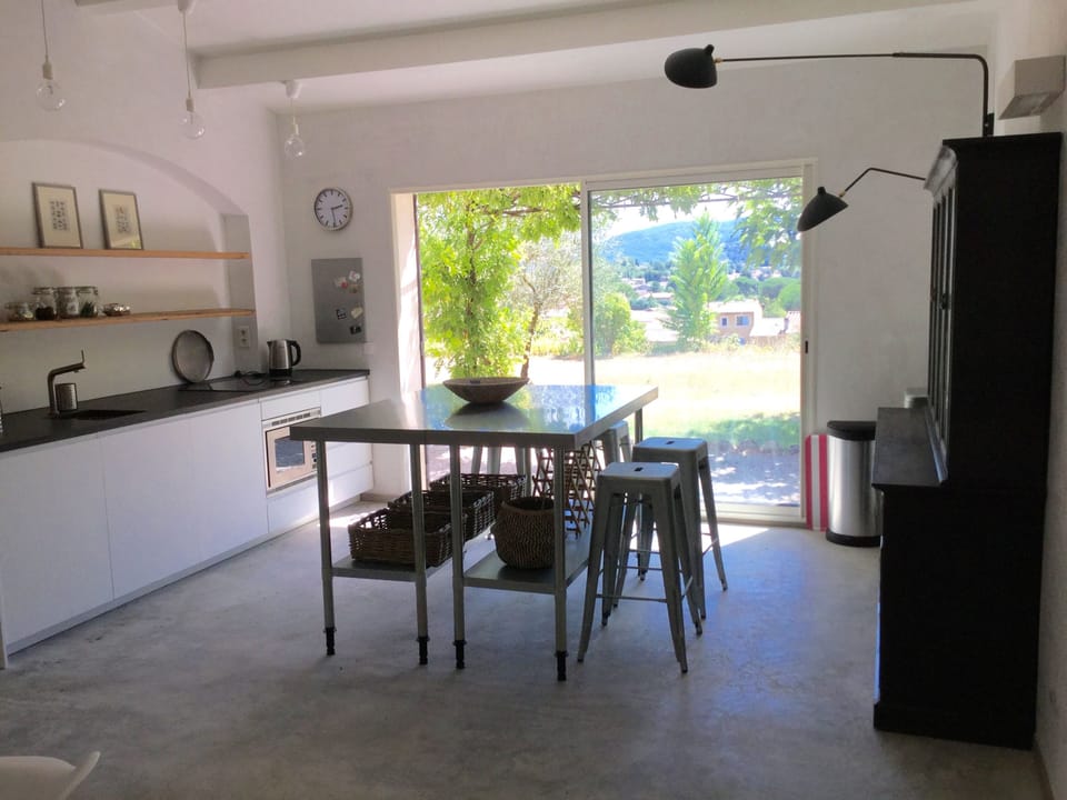 New kitchen with granite work top and cool concrete floors
