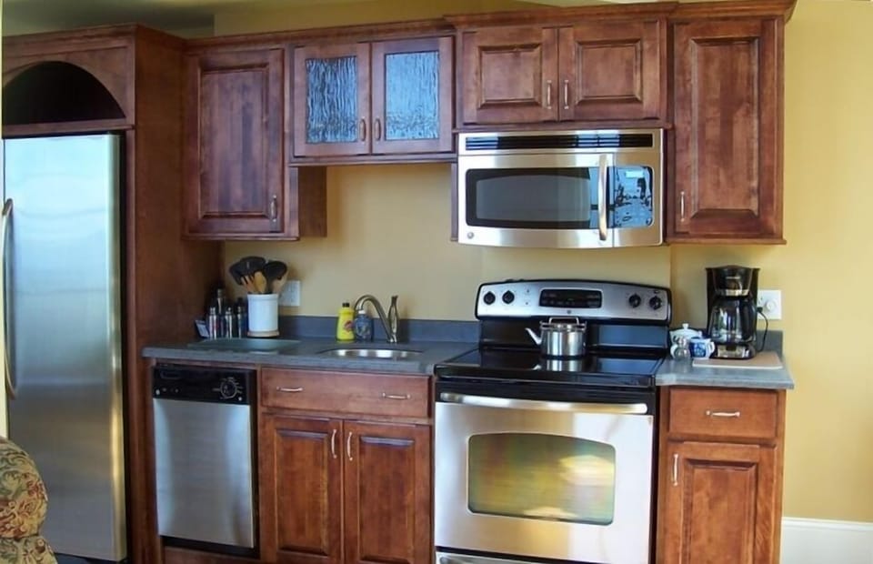 Refrigerator/freezer side by side with ice , dishwasher, stove/oven,microwave.