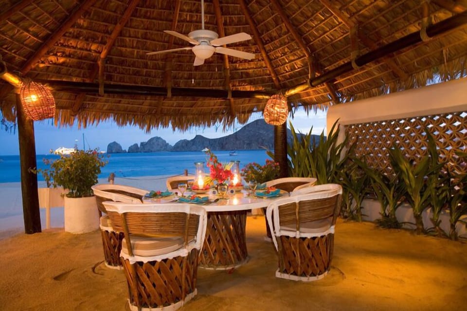 Outdoor palapa bar dining. The table is now larger and sits 10.
