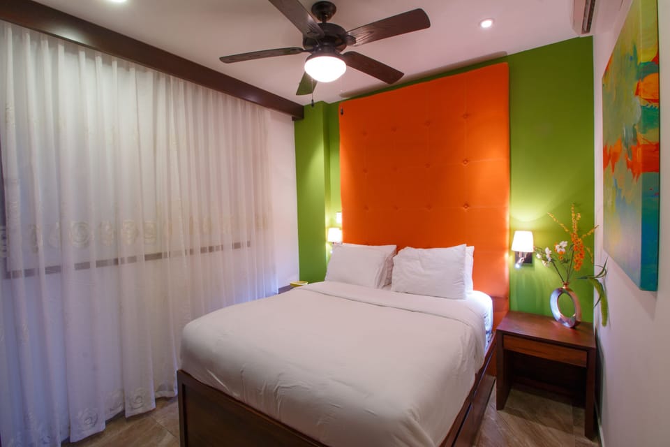 2nd bedroom with bathroom inn hall, lots of closet and storage cubbies