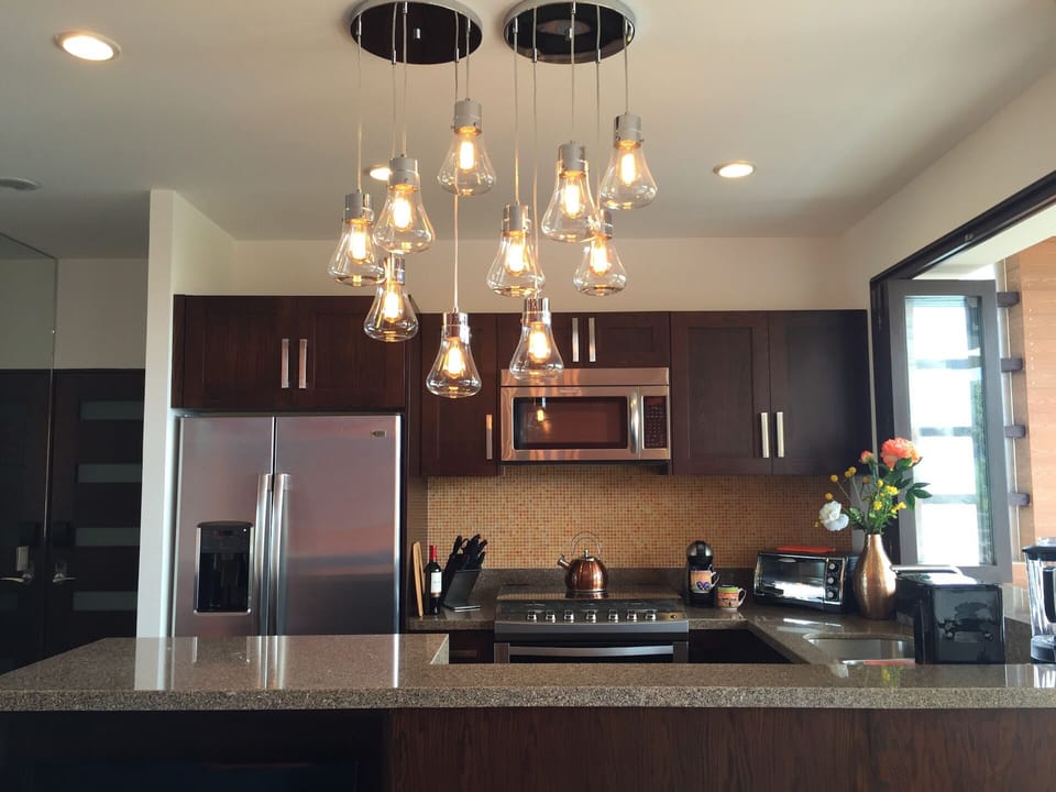 well equipped kitchen with 6 burner gas stove & pass through to terrace