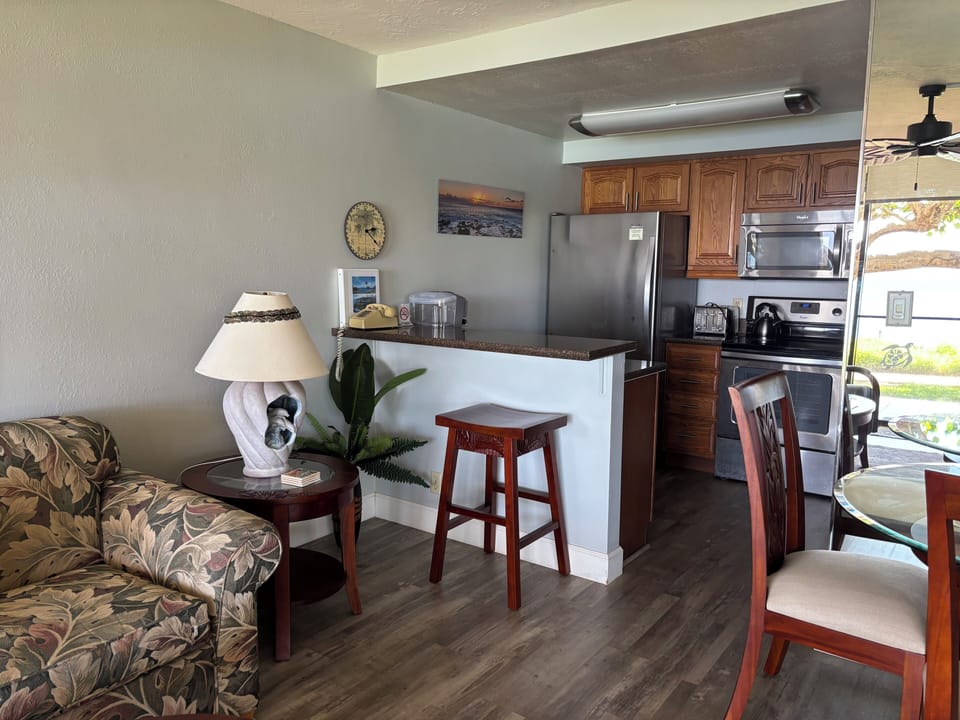 Kitchen has stainless steel appliances with quartz counters. w Keurig single cup