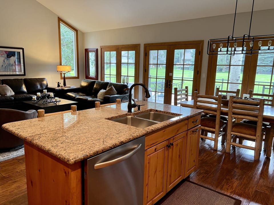 Kitchen with granite counters, stainless steel appliances, with gas range