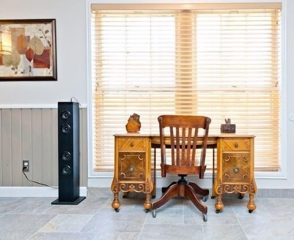 Work area with speaker tower to hook your personal devices to