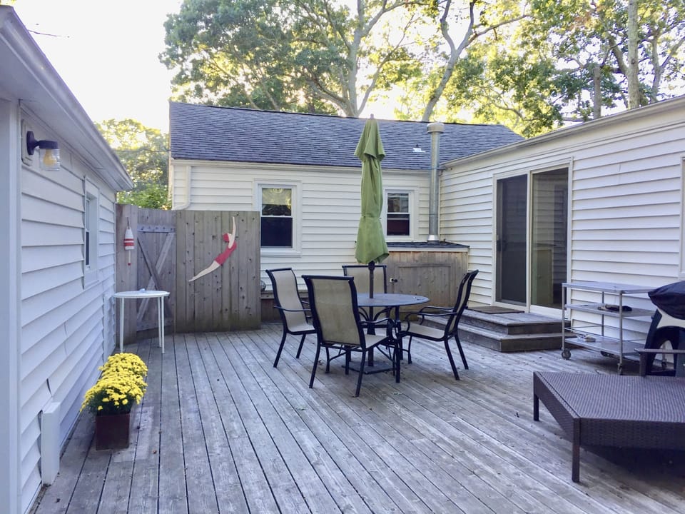 Beautiful backyard deck with outdoor shower.