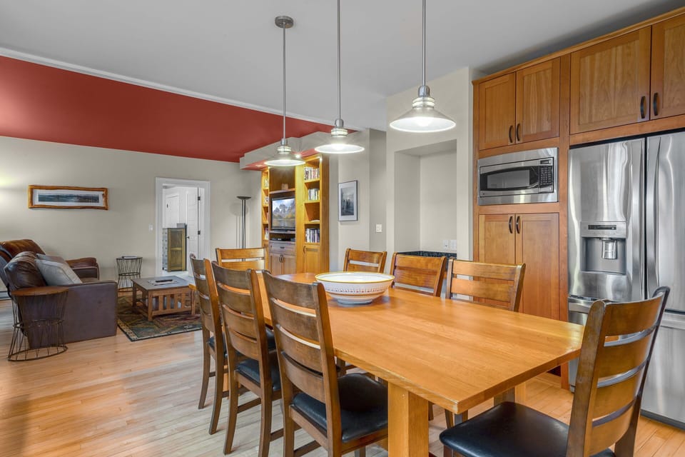 The kitchen extends into the entertainment center area with an open floor plan