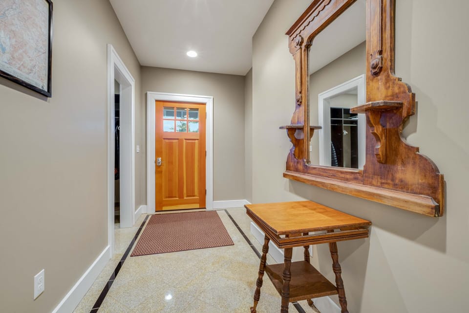Our entrance foyer with a large closet on the left, heated floors.