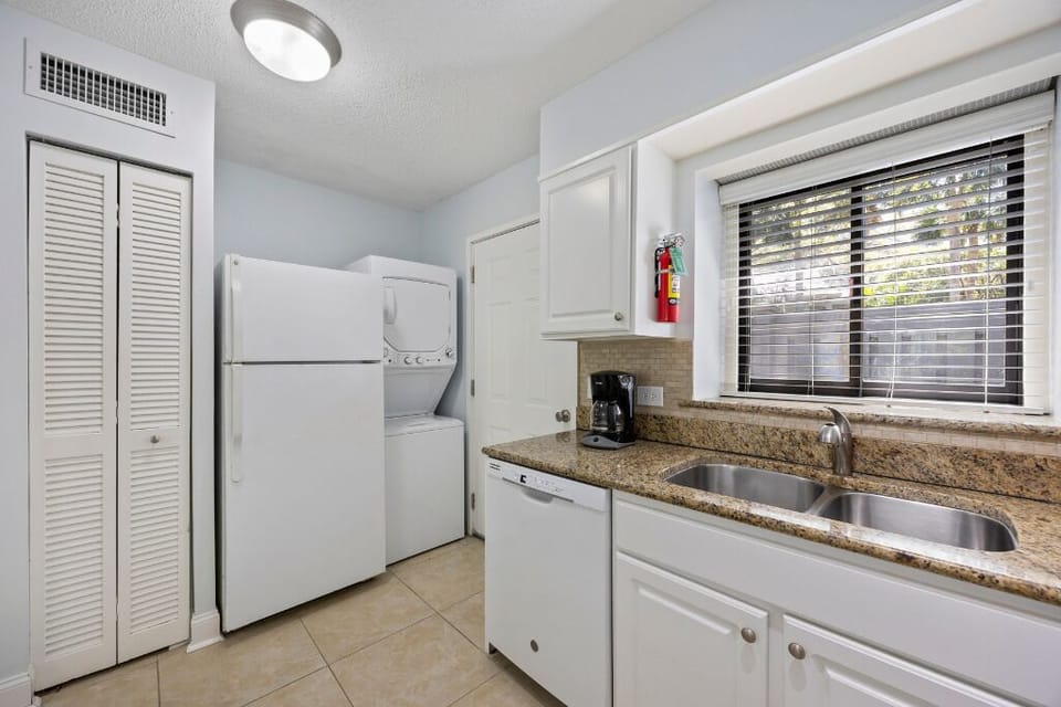 Enjoy added convenience with in-unit laundry beside the kitchen sink.
