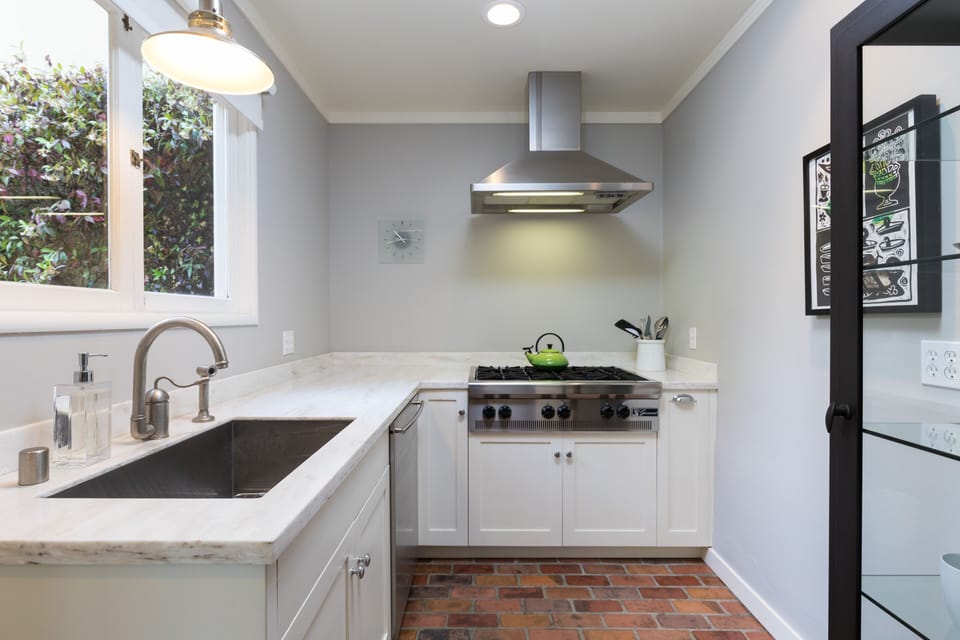 All stainless appliances- Wolf range, Bosch DW, and Large Kitchen sink 