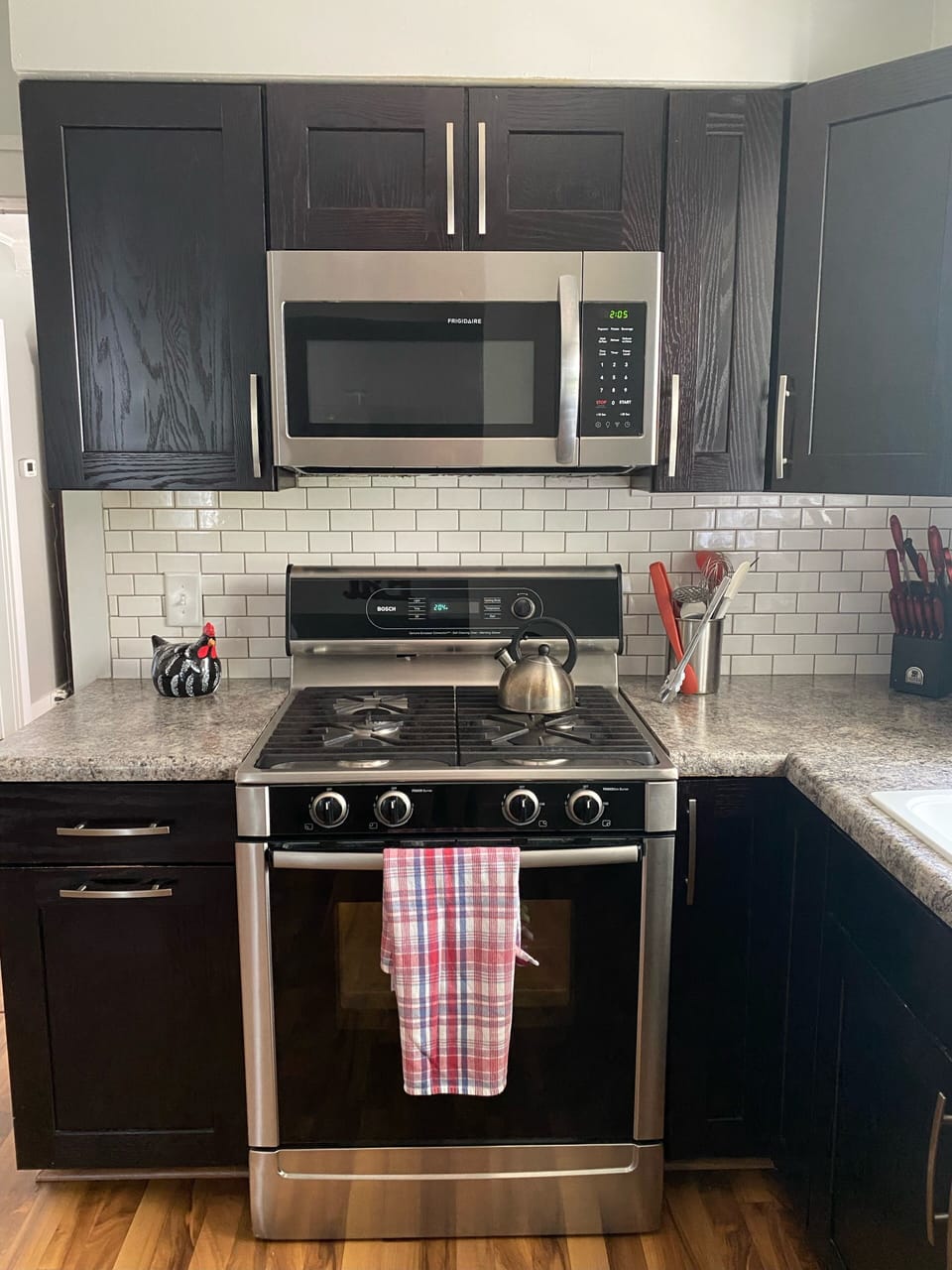 Kitchen with duel-fuel Bosch range and Bosch dishwasher.
