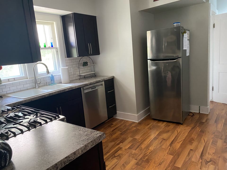 Kitchen with duel-fuel Bosch range and Bosch dishwasher.