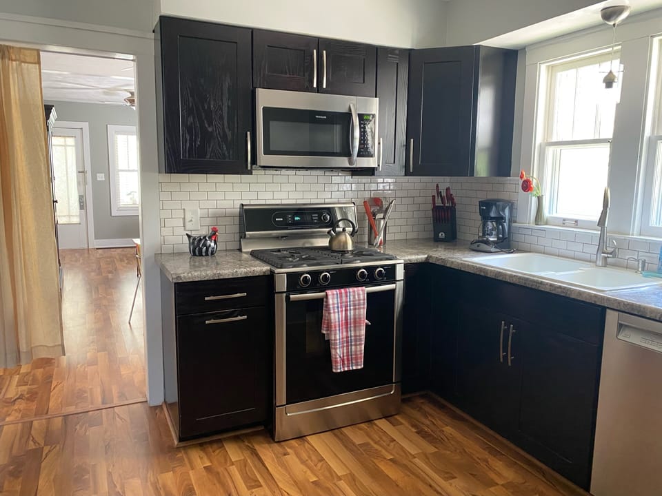 Kitchen with duel-fuel Bosch range and Bosch dishwasher.