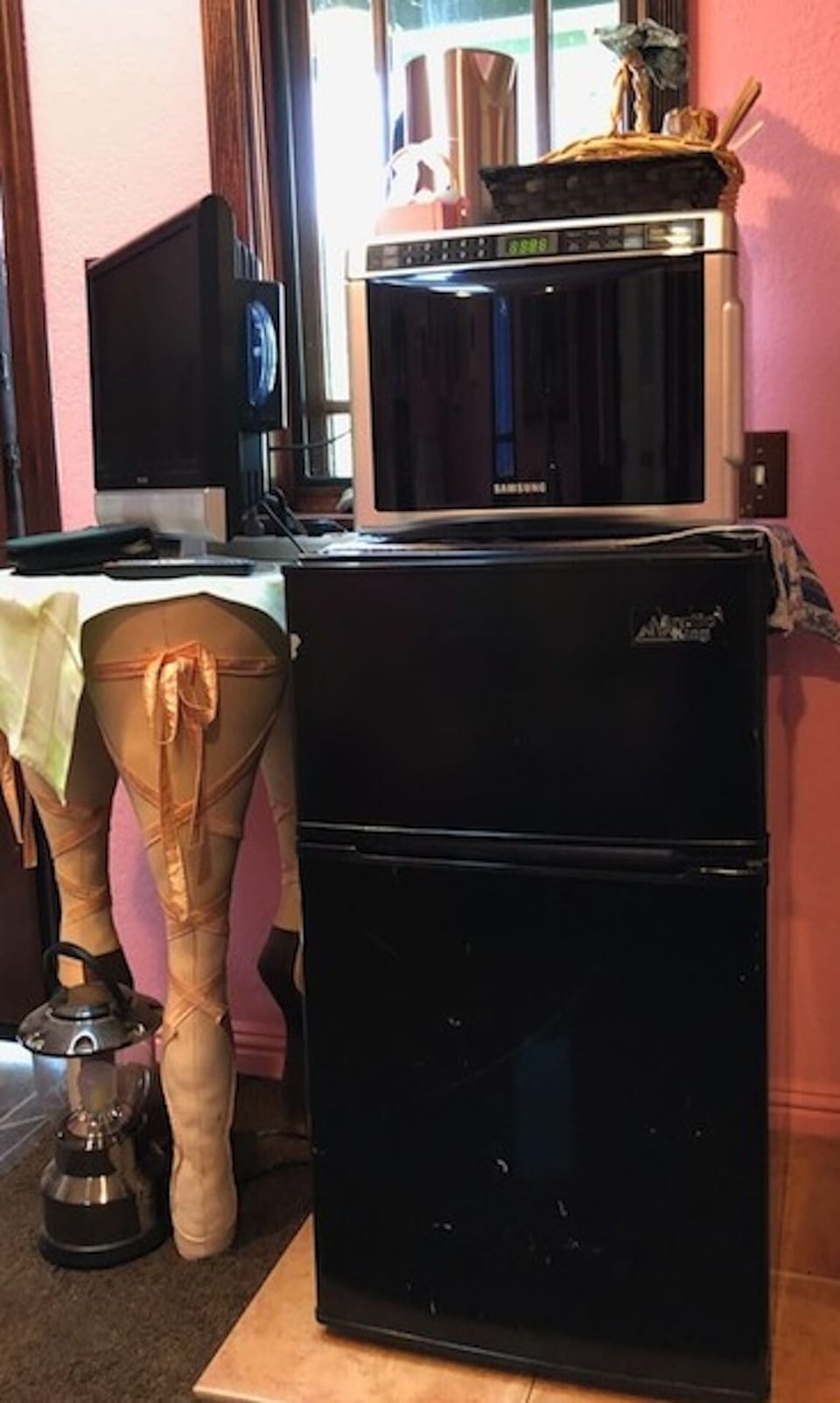 Provided is a small refrigerator, microwave, electric teakettle and DVD/TV combo