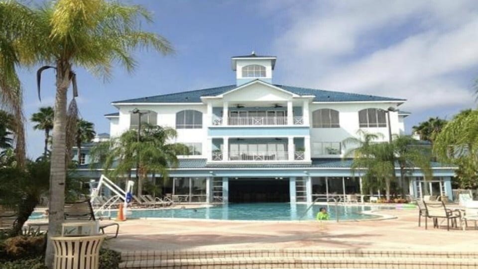 clubhouse and outer pool that merges with inside pool