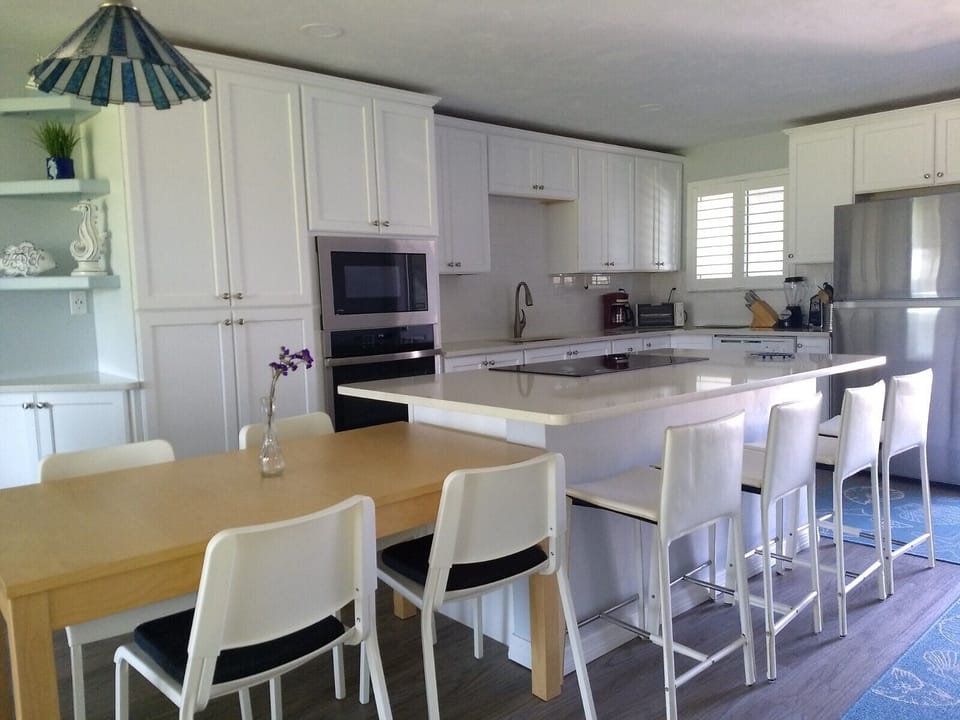 Dining table can be moved to meet your needs, adjacent to kitchen area