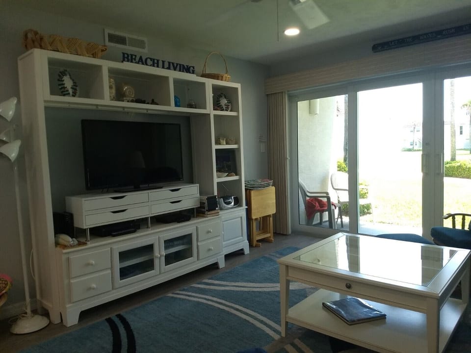 Entertainment center with one of 3 TVs in unit, DVR,...