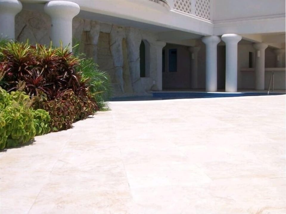 Deck area and swimming pool, part shade & part sun, with its own waterfall