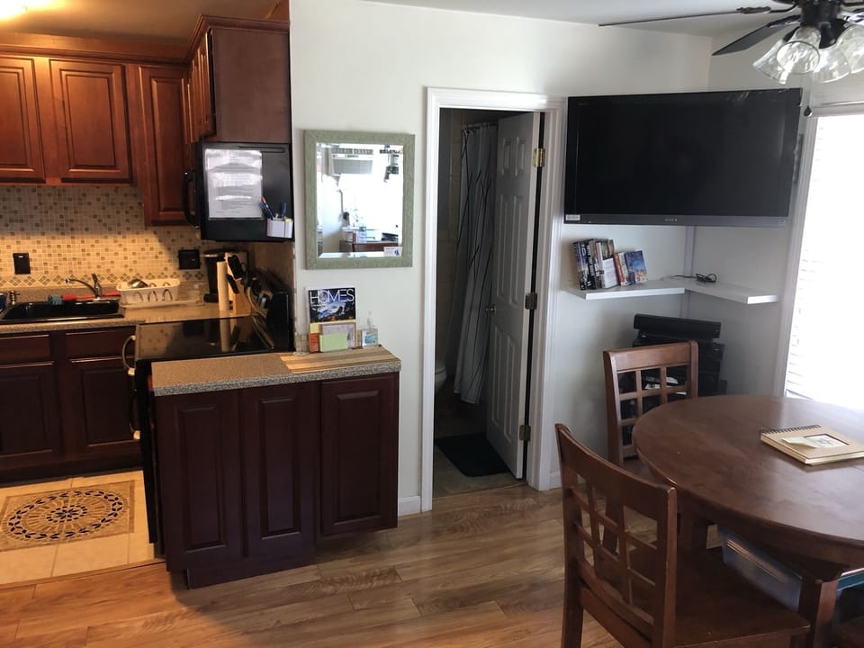 A cozy and casual dining area is open with the living area and kitchen.