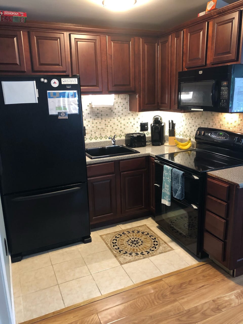Full size refrigerator with bottom drawer freezer, double oven, microwave, sink
