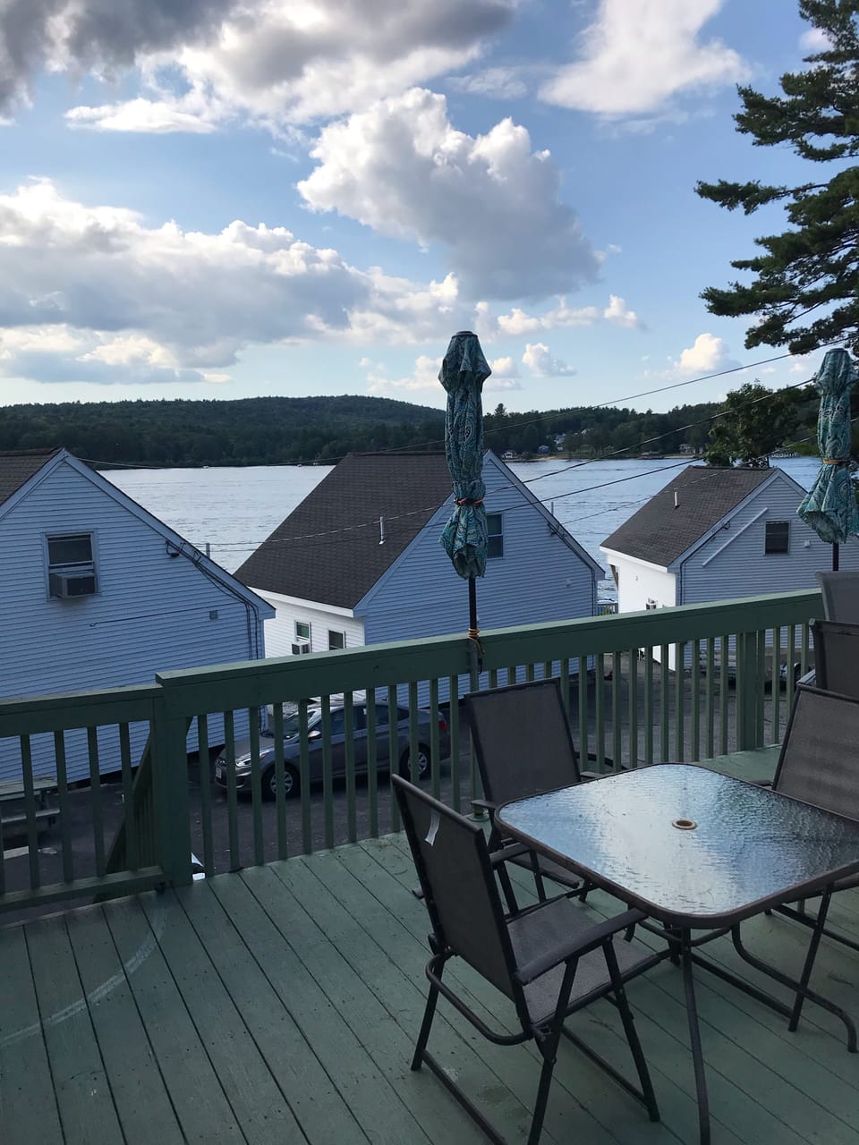 Enjoy dinner on our attached deck with an elevated West view over Paugus Bay.