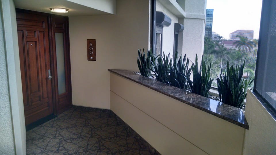 Entrance door to condo from open air atrium