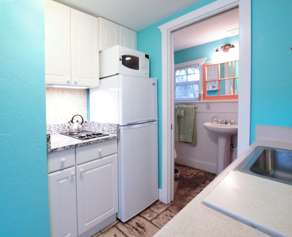 Two top burner, microwave, full sized counter top oven, toaster oven & coffee