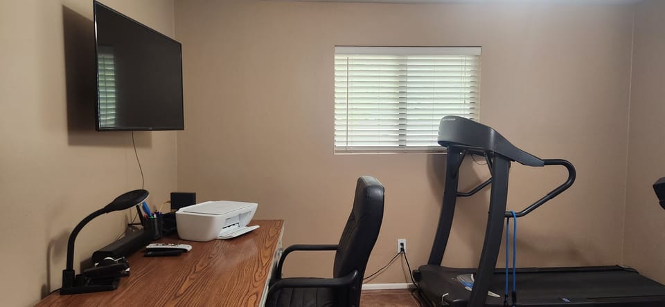 Office with desk, printer, TV and exercise equip. (Owner locked closet in here.)
