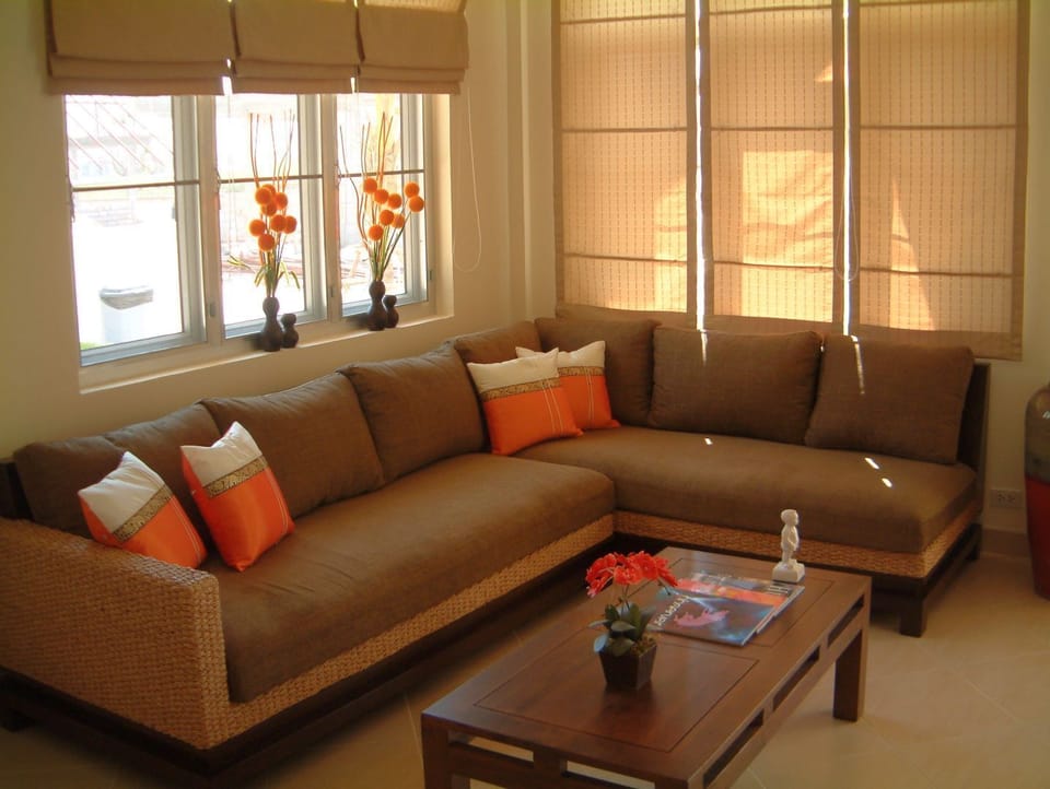 Comfortable sofa. In case of 7/8 person queen bed behind the sofa.