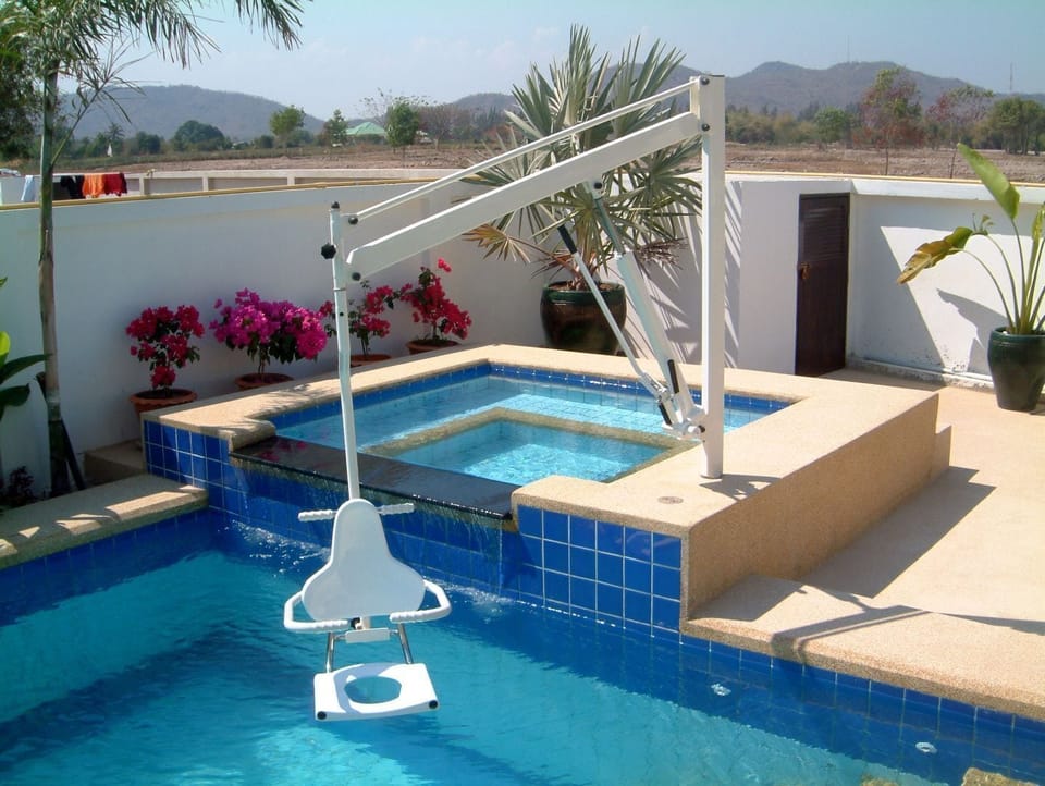 Disabled pool access with pool hoist and bannister.